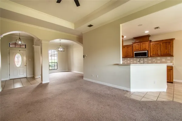 a view of a kitchen with a sink and a window