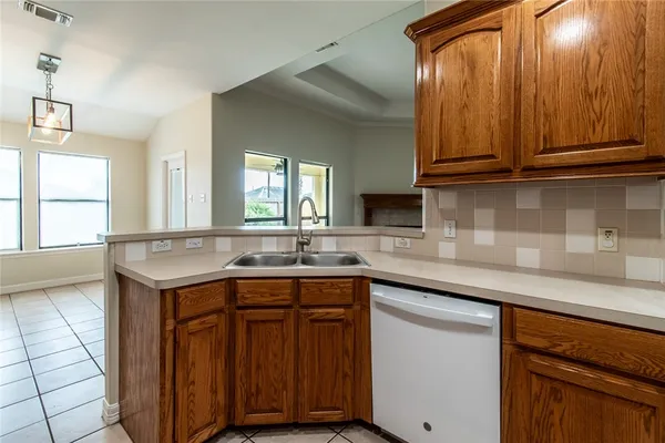 a kitchen with a sink and cabinets