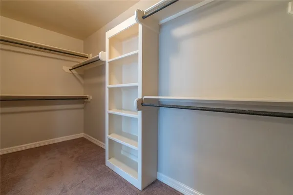 a view of an empty walk in closet