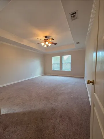 a view of a kitchen with a sink and a refrigerator