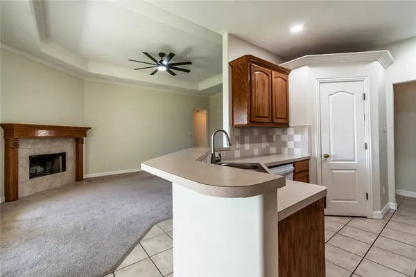 a kitchen with kitchen island a sink stainless steel appliances and cabinets