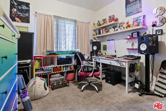 a storage room with furniture and a flat screen tv
