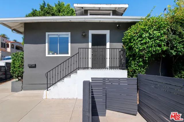 a view of a house with a tree