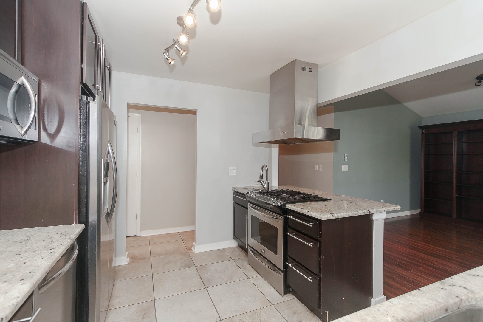 2170 Savannah Road Elgin, IL 60123 - Photo 8 of 25 a kitchen with stainless steel appliances granite countertop a stove and a sink