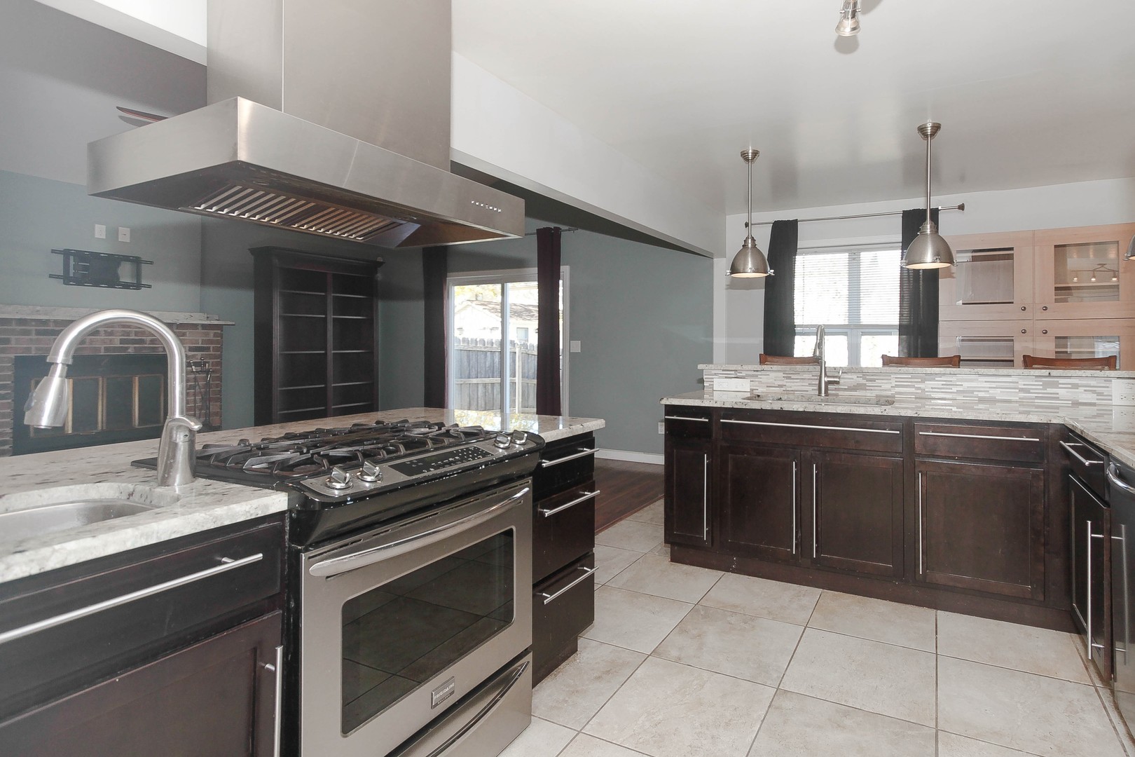 2170 Savannah Road Elgin, IL 60123 - Photo 9 of 25 a kitchen with stainless steel appliances granite countertop a stove and a sink