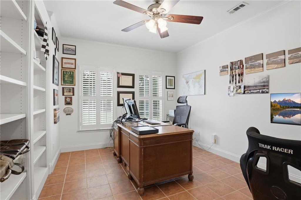 2950 Callie Still Road Lawrenceville, GA 30045 - Photo 40 of 77 a room with furniture a flat screen tv and a window