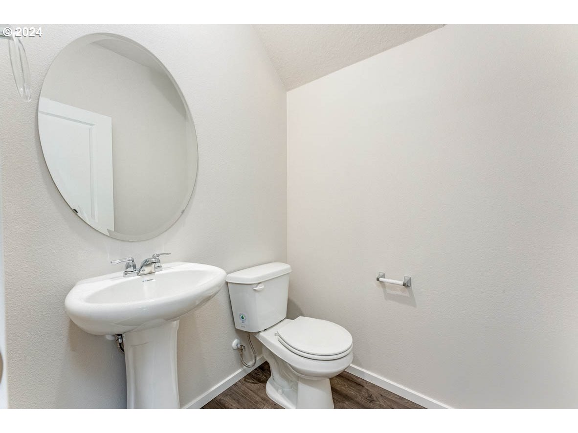2654 U Street Springfield, OR 97477 - Photo 3 of 27 a bathroom with a sink toilet and a mirror