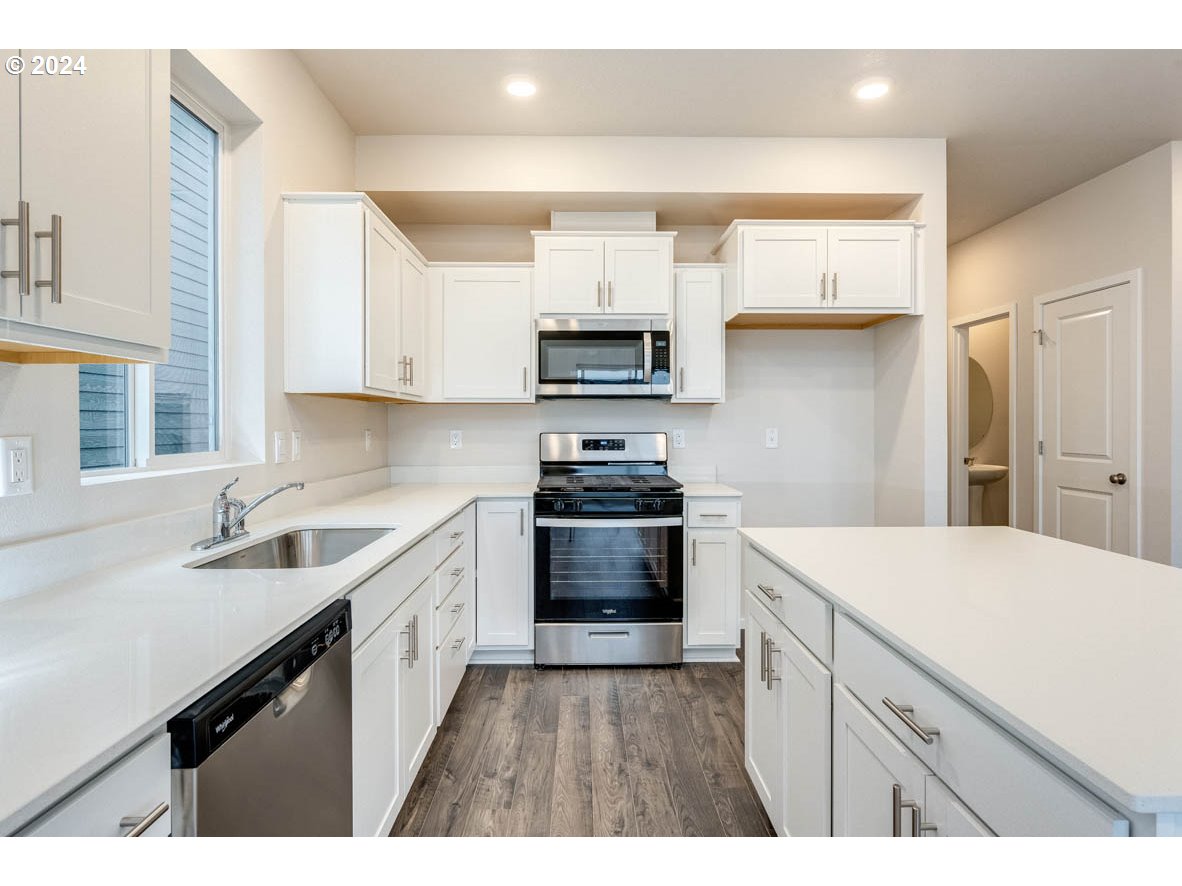2654 U Street Springfield, OR 97477 - Photo 8 of 27 a kitchen with a sink stove and microwave