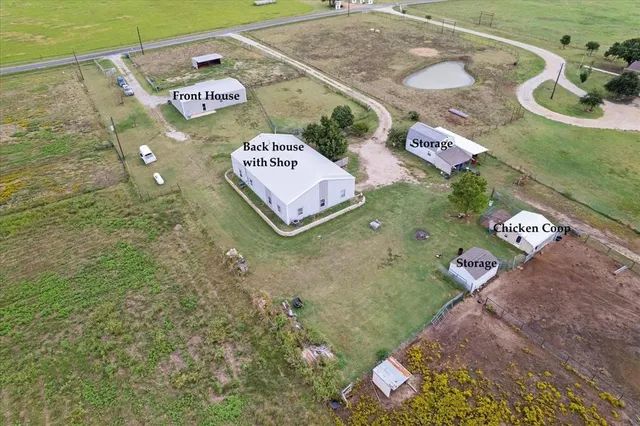 a sign that is sitting in front of a house