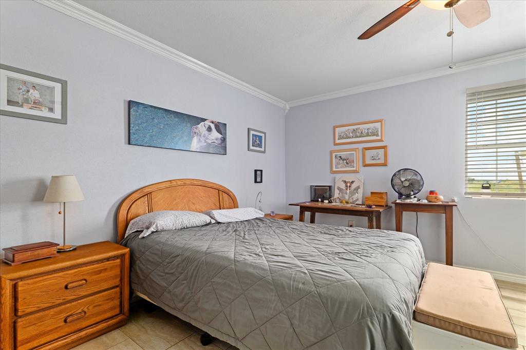 3300 Airport Road Tioga, TX 76271 - Photo 23 of 37 a bed room with a bed and a lamp