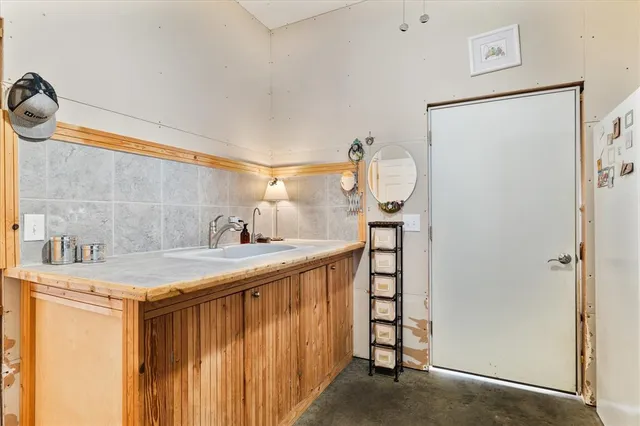 a bathroom with a sink and a mirror
