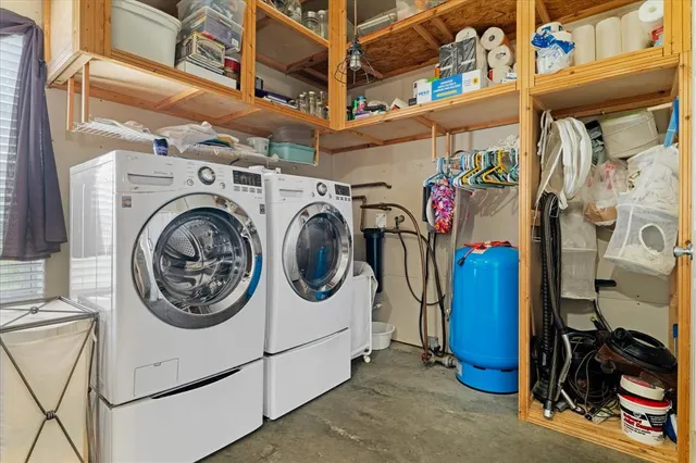 a utility room with dryer and washer