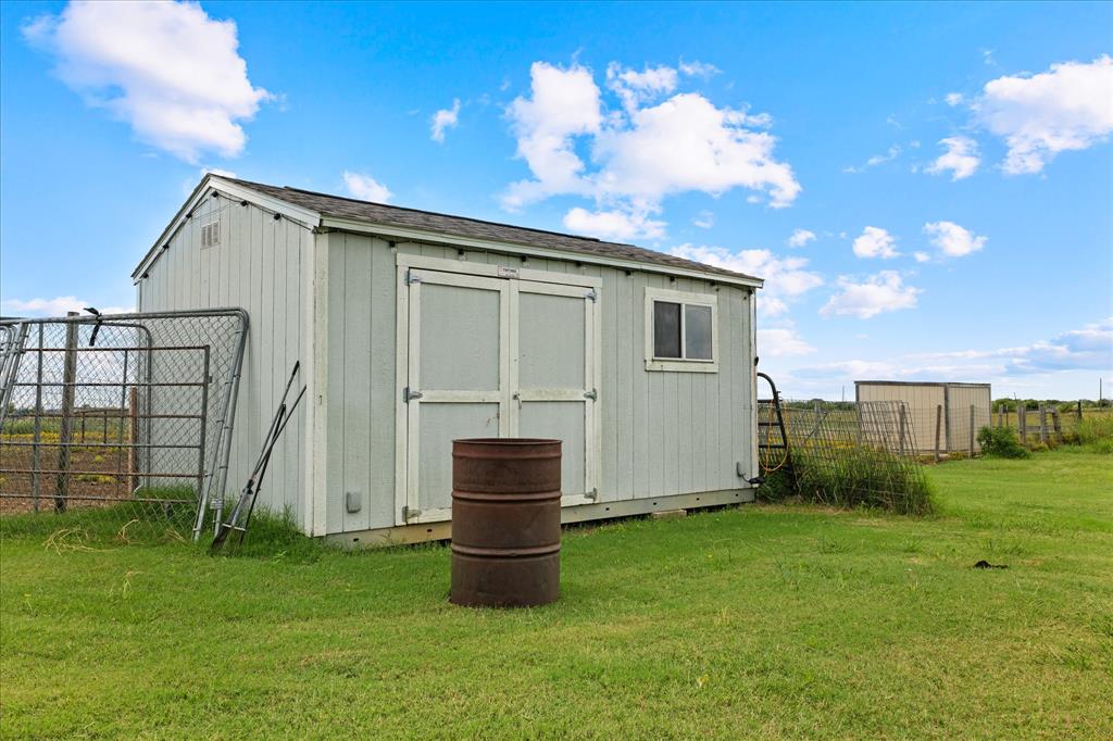 3300 Airport Road Tioga, TX 76271 - Photo 27 of 37 a view of backyard with barbeque grill potted plants and wooden fence