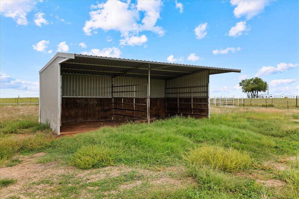 3300 Airport Road Tioga, TX 76271 - Photo 28 of 37 a view of a backyard with a garden and entertaining space