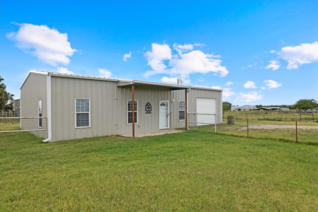 3300 Airport Road Tioga, TX 76271 - Photo 32 of 37 a view of a house with backyard and a garden