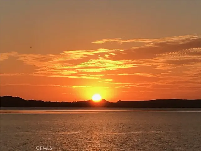 a view of an ocean from sunset