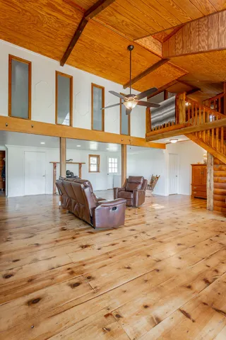 a kitchen with appliances cabinets and wooden floor