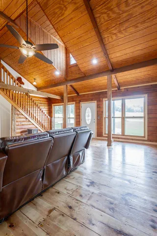 a kitchen with granite countertop cabinets stainless steel appliances and a window