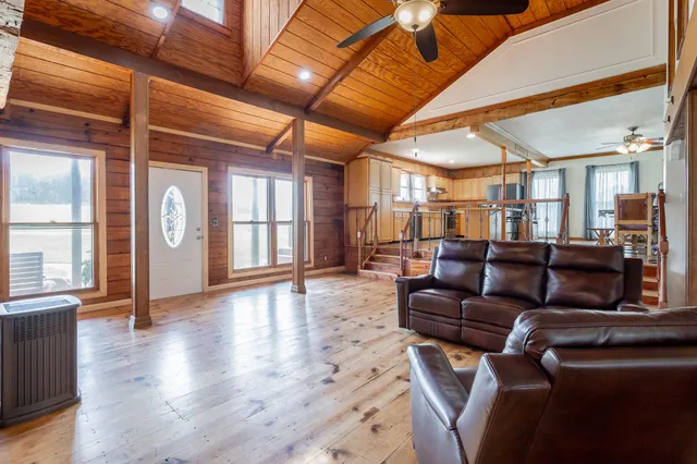 a kitchen with stainless steel appliances a stove top oven a sink and cabinets