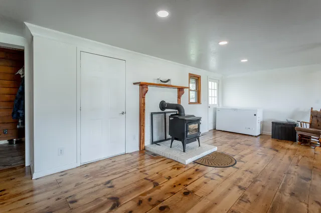 a bedroom with a bed couch and window