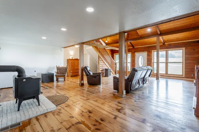 a bedroom with a large bed and a dresser