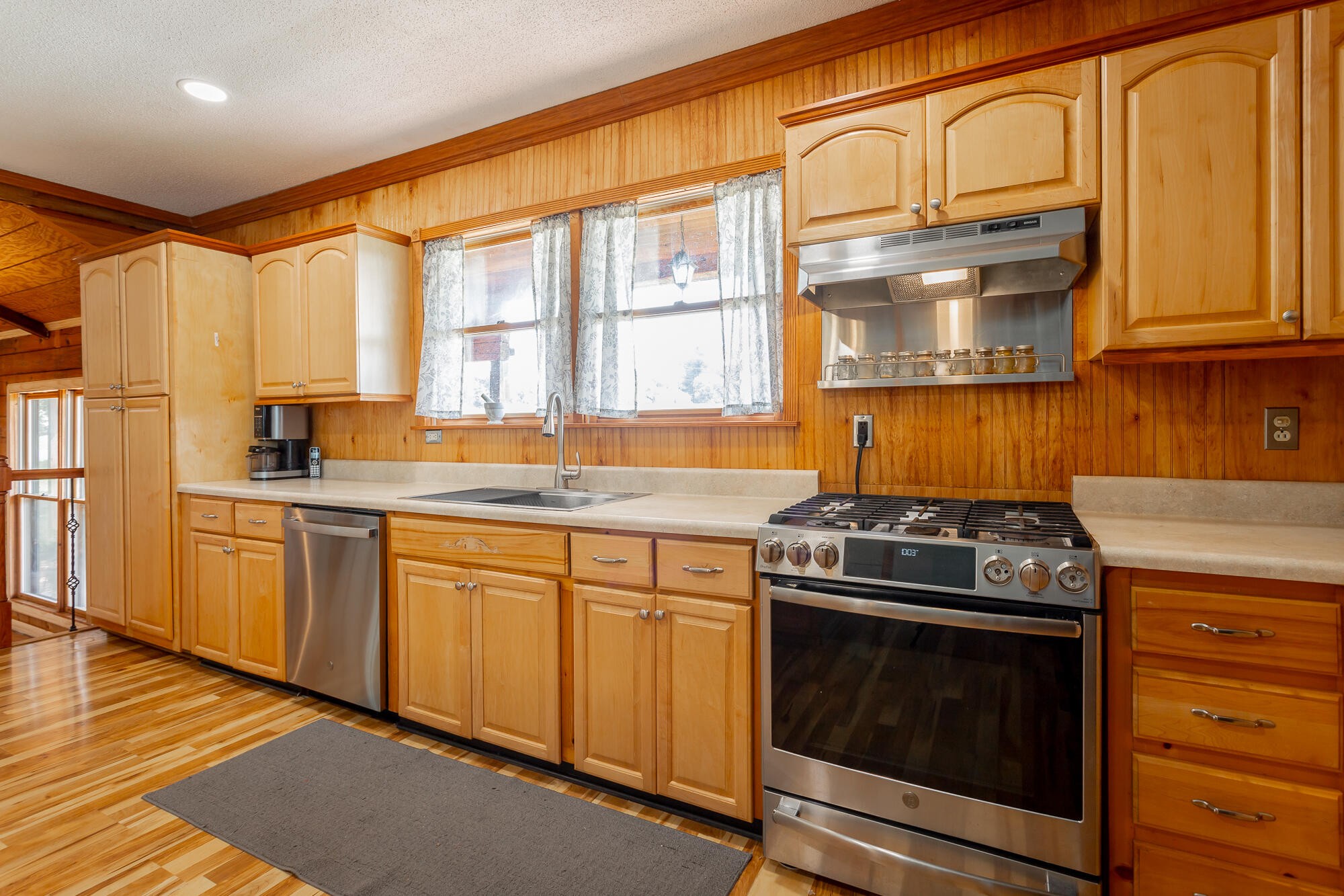 2195 Myers Road Pikeville, TN 37367 - Photo 40 of 100 a kitchen with stainless steel appliances granite countertop a stove a sink and a microwave