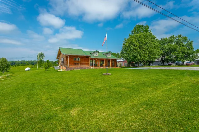 a view of a house with a big yard