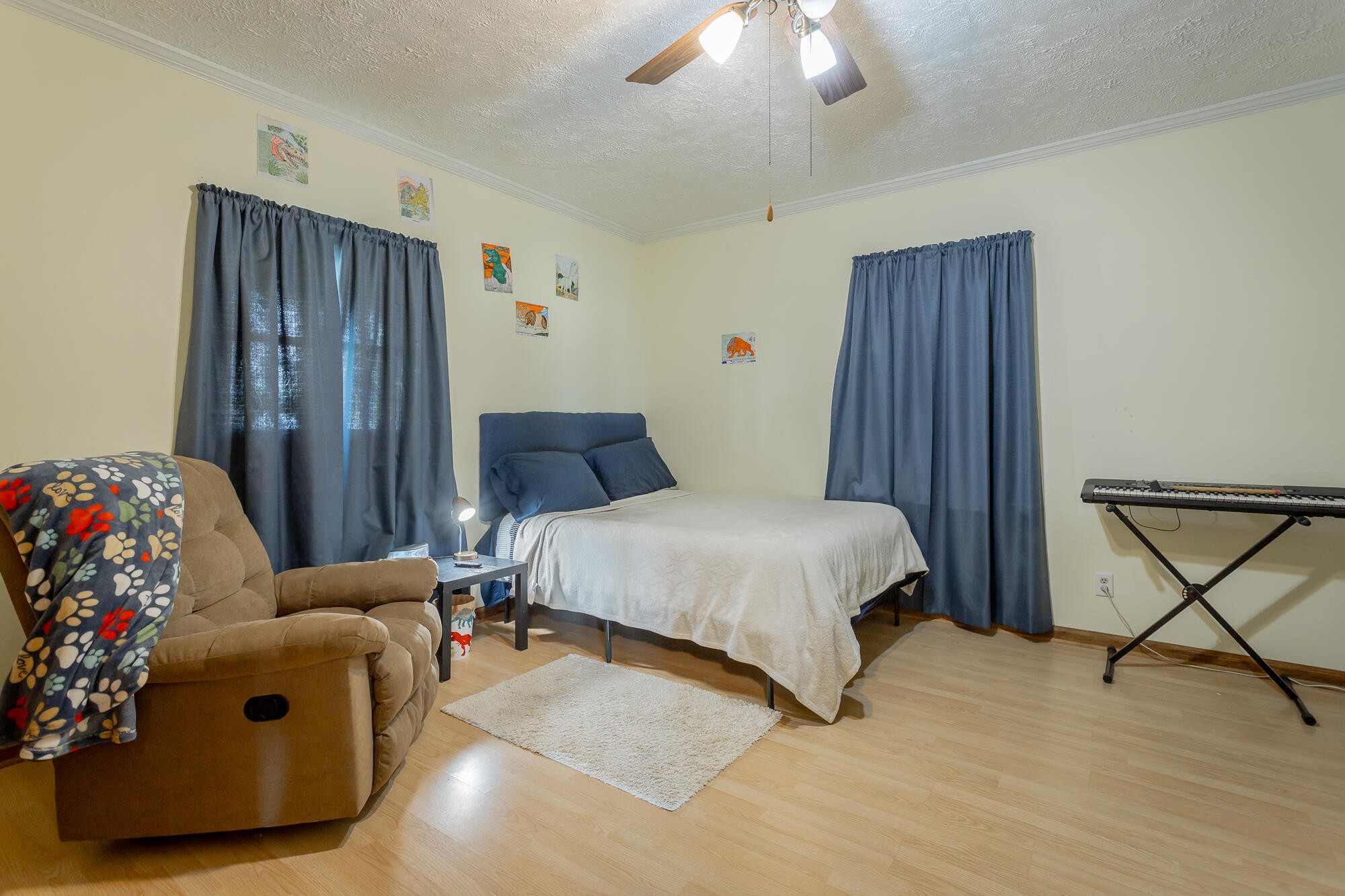 2195 Myers Road Pikeville, TN 37367 - Photo 52 of 100 a bedroom with a bed and a chandelier