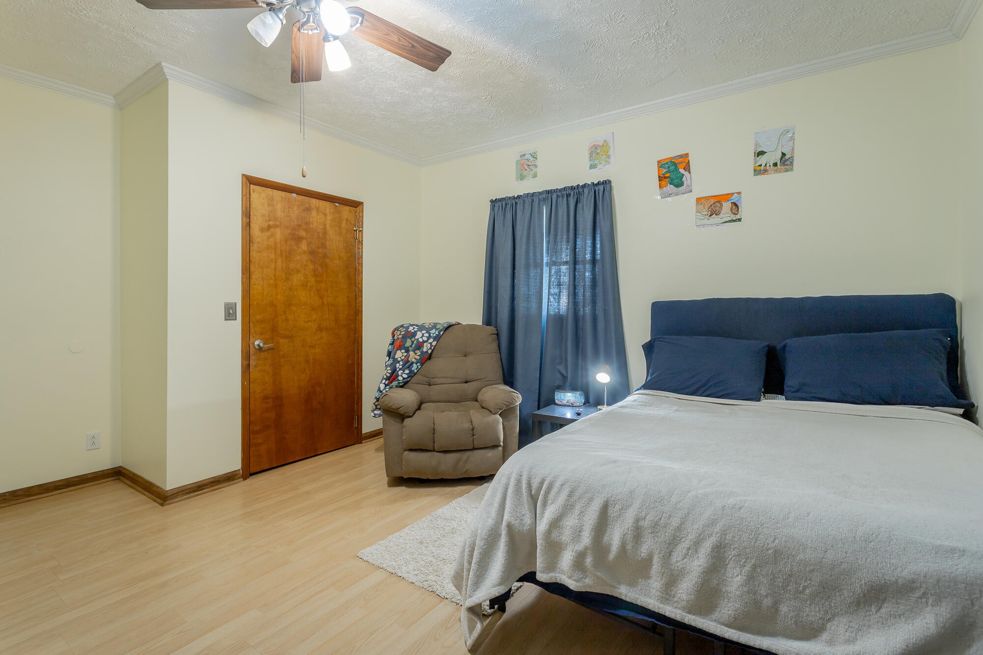 2195 Myers Road Pikeville, TN 37367 - Photo 54 of 100 a bedroom with a bed and a chandelier