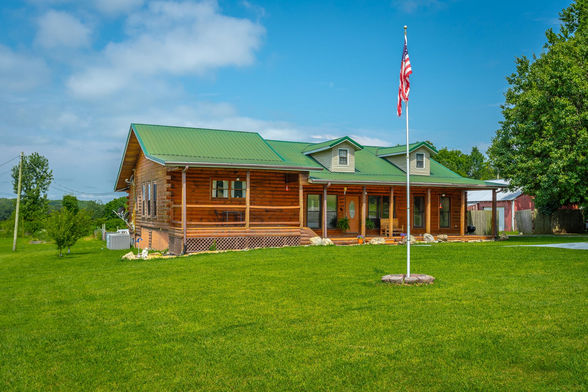 2195 Myers Road Pikeville, TN 37367 - Photo 7 of 100 a view of a house with a backyard and plants