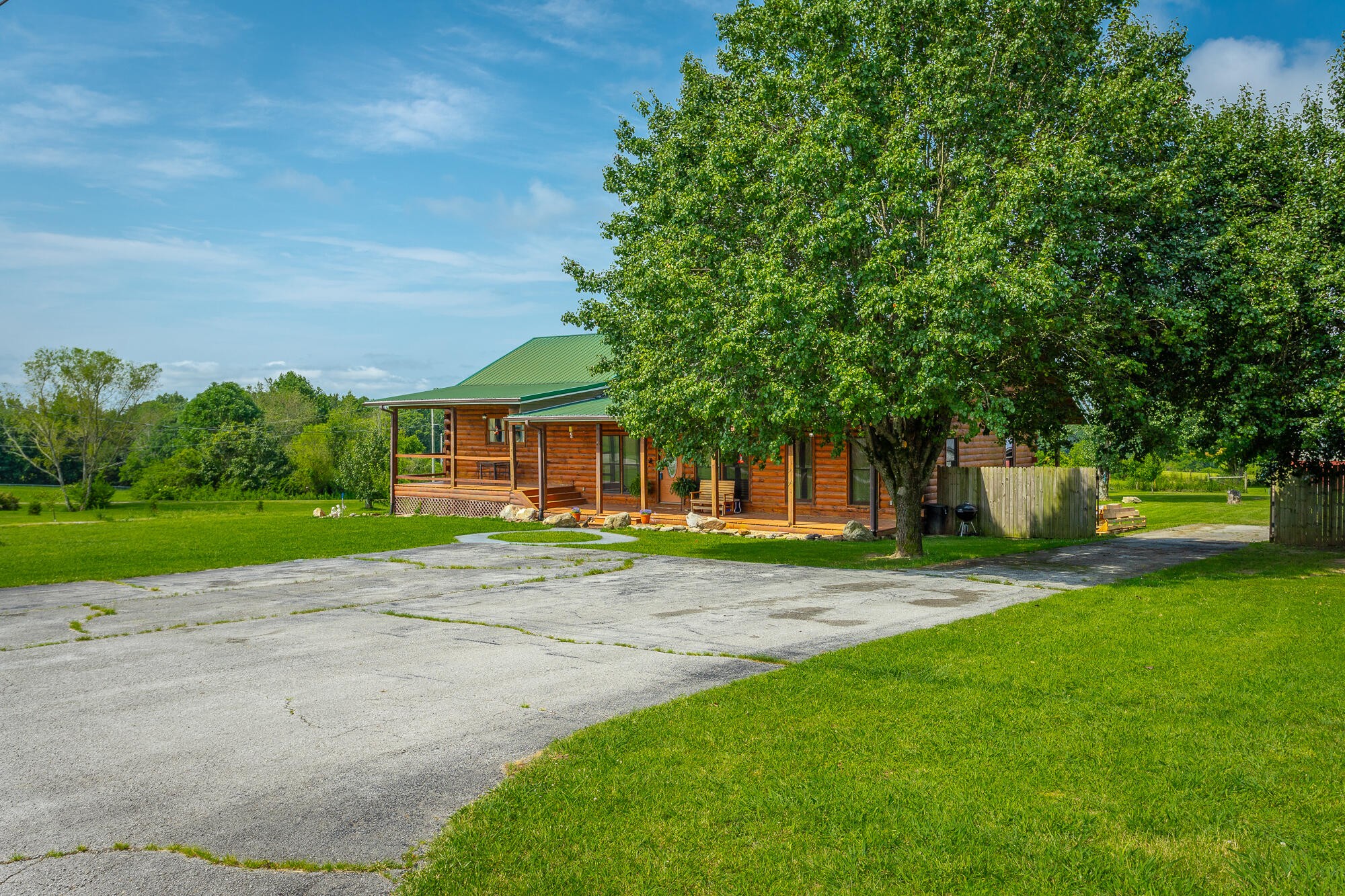 2195 Myers Road Pikeville, TN 37367 - Photo 9 of 100 a view of a house with a big yard and large trees