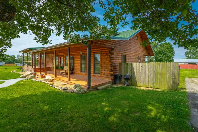 a outdoor space with the couches and dining table view