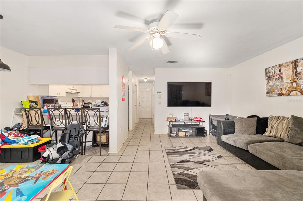 2735 Southwest 35th Place, Unit 801 Gainesville, FL 32608 - Photo 11 of 35 a living room with furniture and wooden floor