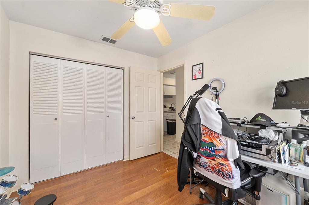 2735 Southwest 35th Place, Unit 801 Gainesville, FL 32608 - Photo 14 of 35 a room with furniture and wooden floor