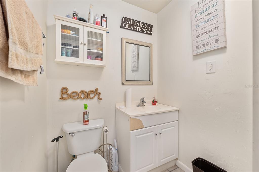 2735 Southwest 35th Place, Unit 801 Gainesville, FL 32608 - Photo 15 of 35 a bathroom with a toilet sink and mirror