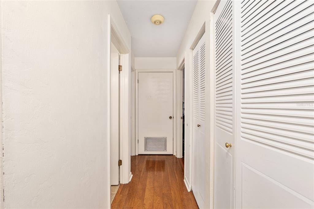 2735 Southwest 35th Place, Unit 801 Gainesville, FL 32608 - Photo 17 of 35 a view of a hallway with wooden floor