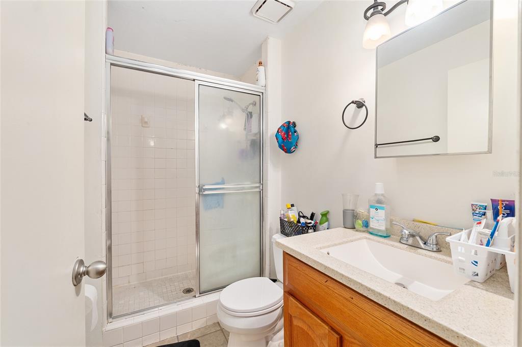 2735 Southwest 35th Place, Unit 801 Gainesville, FL 32608 - Photo 20 of 35 a bathroom with a sink a toilet and a shower