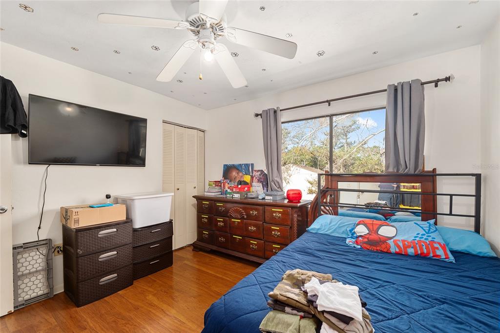 2735 Southwest 35th Place, Unit 801 Gainesville, FL 32608 - Photo 22 of 35 a living room with furniture and a flat screen tv