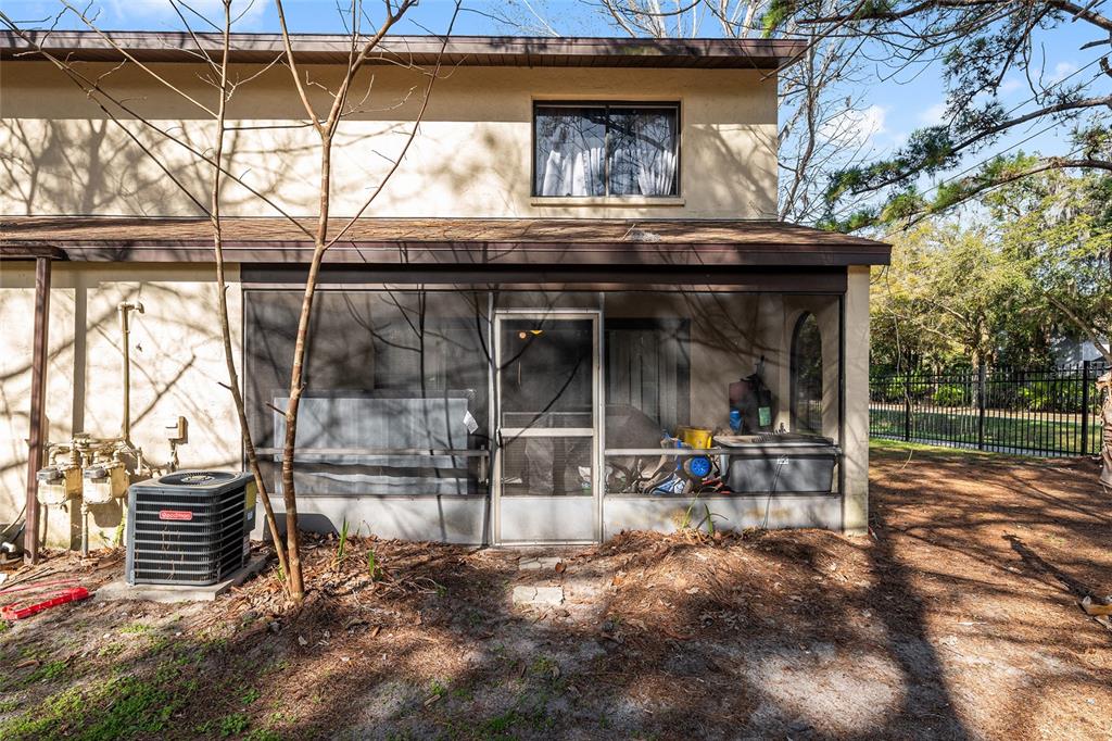 2735 Southwest 35th Place, Unit 801 Gainesville, FL 32608 - Photo 26 of 35 a view of sitting area with wooden walls