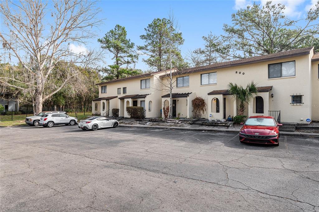 2735 Southwest 35th Place, Unit 801 Gainesville, FL 32608 - Photo 33 of 35 a couple of cars parked in front of a house