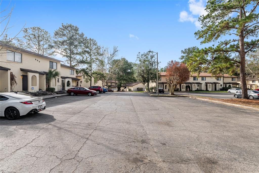 2735 Southwest 35th Place, Unit 801 Gainesville, FL 32608 - Photo 34 of 35 a view of street with parked cars