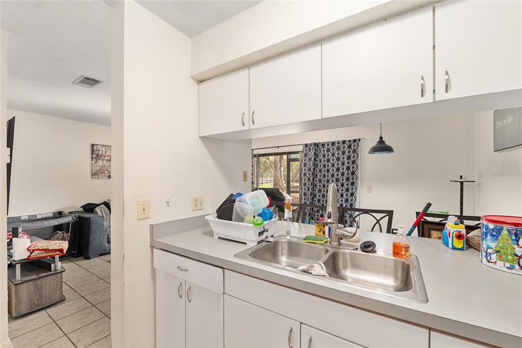 2735 Southwest 35th Place, Unit 801 Gainesville, FL 32608 - Photo 10 of 35 a bathroom with sink and a mirror