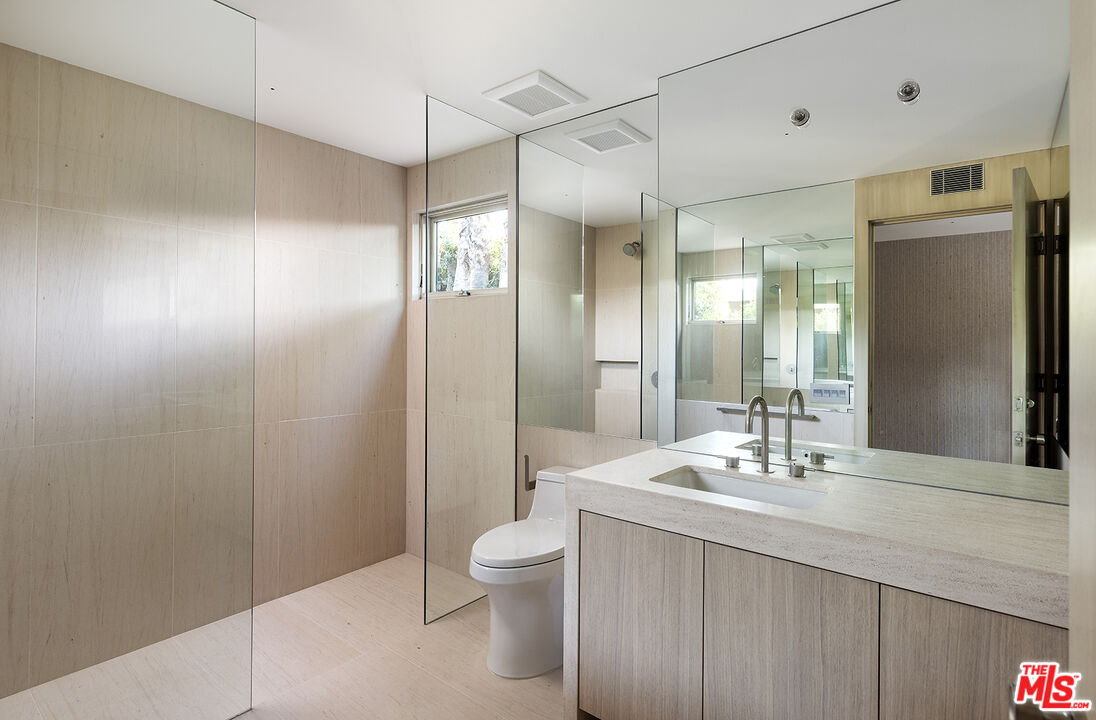 40281 Sand Dune Road Rancho Mirage, CA 92270 - Photo 27 of 39 a bathroom with a sink a toilet and shower