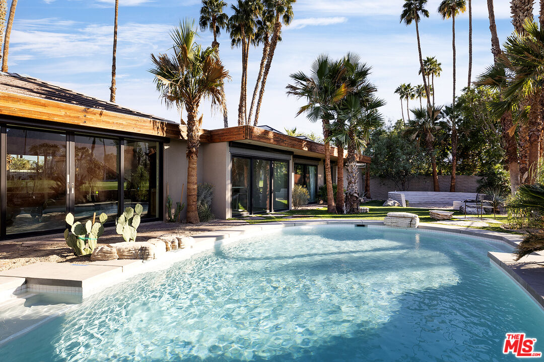 40281 Sand Dune Road Rancho Mirage, CA 92270 - Photo 28 of 39 a view of a house with swimming pool and sitting area