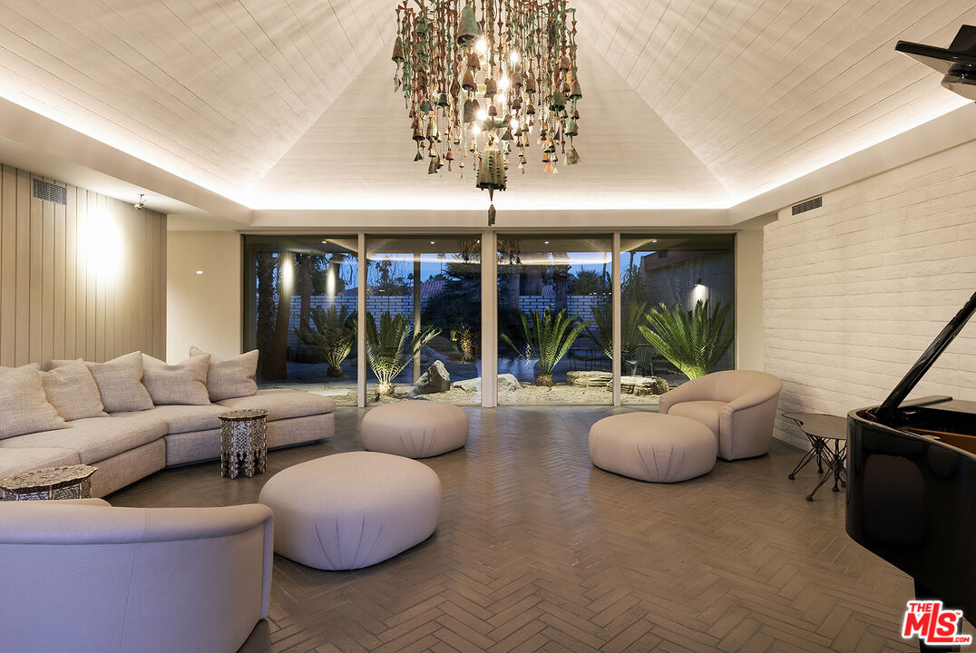 40281 Sand Dune Road Rancho Mirage, CA 92270 - Photo 8 of 39 a living room with furniture and a large window