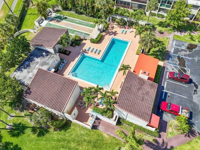 an aerial view of residential house with outdoor space and street view
