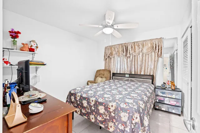 a bedroom with a bed and a table