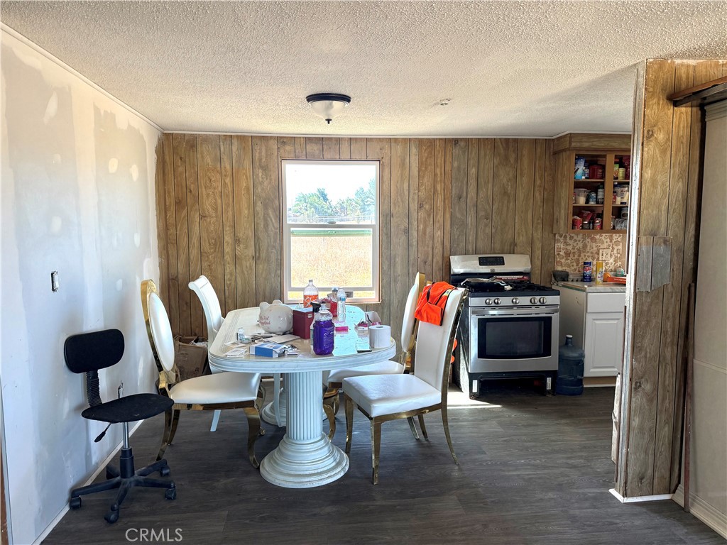 9589 Paramount Road Phelan, CA 92371 - Photo 12 of 29 a view of a dining room with furniture window and outside view