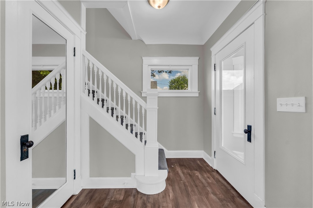 3506 Riverside Avenue Cleveland, OH 44109 - Photo 11 of 31 Staircase featuring white balusters and dark treads