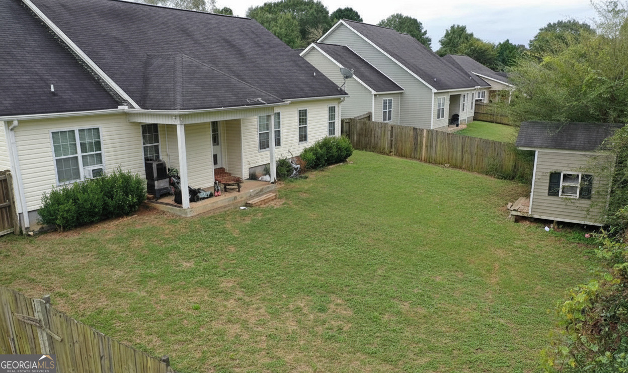 201 Boulder Creek Road Kathleen, GA 31047 - Photo 20 of 21 a view of a house with a backyard